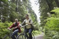 Middle Aged Couple With Bikes In Forest Royalty Free Stock Photo