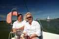 Middle-aged couple on boat sailing Royalty Free Stock Photo