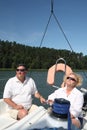 Middle-aged couple on boat sailing Royalty Free Stock Photo