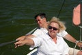 Middle-aged couple on boat sailing Royalty Free Stock Photo