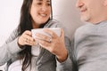 Middle-aged couple eating popcorn and watching a movie Royalty Free Stock Photo