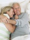 Middle Aged Couple Embracing In Bed Royalty Free Stock Photo