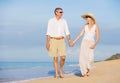 Middle Aged Couple Enjoying Walk on the Beach Royalty Free Stock Photo