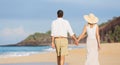 Middle Aged Couple Enjoying Walk on the Beach Royalty Free Stock Photo