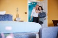 Middle aged couple hugging in the doorway of a hotel room Royalty Free Stock Photo