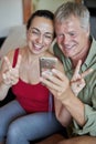 Middle-aged couple looking a mobile phone Royalty Free Stock Photo