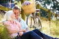 Middle Aged Couple Relaxing On Country Cycle Ride Royalty Free Stock Photo