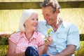 Middle Aged Couple Relaxing In Countryside Royalty Free Stock Photo