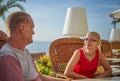 Middle Aged Couple Seafront Terrace