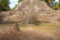 Couple in front of the High Temple at Lamanai Archaeological Reserve in Northern Belize