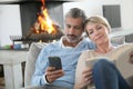 Middle-aged couple using smartphones Royalty Free Stock Photo