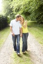 Middle aged couple walking in countryside Royalty Free Stock Photo