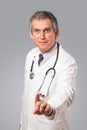 Middle aged doctor gesturing with copy space Royalty Free Stock Photo