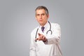 Middle aged doctor gesturing with copy space Royalty Free Stock Photo