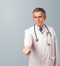Middle aged doctor gesturing with copy space Royalty Free Stock Photo