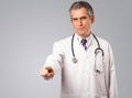 Middle aged doctor gesturing with copy space Royalty Free Stock Photo