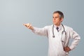 Middle aged doctor gesturing with copy space Royalty Free Stock Photo