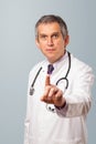 Middle aged doctor gesturing with copy space Royalty Free Stock Photo
