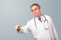 Middle aged doctor gesturing with copy space Royalty Free Stock Photo