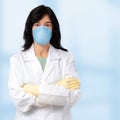 Middle aged doctor wearing surgical mask and gloves Royalty Free Stock Photo