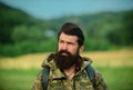 Middle aged farmer, closeup male farmer portrait. Portrait of middle aged bearded man, outdoors in meadow. Man portrait Royalty Free Stock Photo