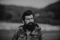 Middle aged farmer, closeup male farmer portrait. Portrait of middle aged bearded man, outdoors in meadow. Man portrait Royalty Free Stock Photo