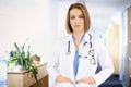 Middle aged female doctor standing in the hospital corridor Royalty Free Stock Photo