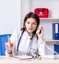 Middle-aged female doctor in telemedicine concept Royalty Free Stock Photo