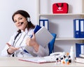 Middle-aged female doctor in telemedicine concept Royalty Free Stock Photo