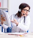 Middle-aged female doctor in telemedicine concept Royalty Free Stock Photo