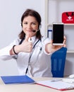 Middle-aged female doctor in telemedicine concept Royalty Free Stock Photo