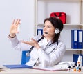 Middle-aged female doctor in telemedicine concept Royalty Free Stock Photo