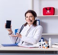 Middle-aged female doctor in telemedicine concept Royalty Free Stock Photo