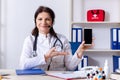 Middle-aged female doctor in telemedicine concept Royalty Free Stock Photo