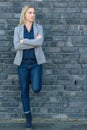 Middle-aged fit woman wearing cool slim blue jeans Royalty Free Stock Photo