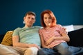 Middle aged well-rested man and woman mature loving married couple relaxed sitting on couch at home. Royalty Free Stock Photo