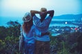 Middle aged Happy Romantic couple travel relax the beach in the holiday and standing watching the sunset. in summer Royalty Free Stock Photo