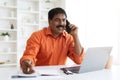 Middle aged hindu man looking for job, have phone call Royalty Free Stock Photo