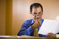 Middle-aged Hispanic businessman working in office