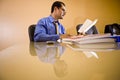 Middle-aged Hispanic businessman working in office