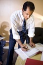 Middle-aged Hispanic businessman working in office