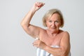 Middle Aged Lady Applying Deodorant on Armpit