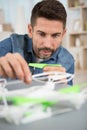 middle aged man assembling drone Royalty Free Stock Photo
