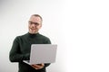 middle-aged man balding in glasses holding laptop joyful fun joy to students a lecture for lectures with a laptop a