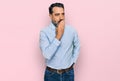 Middle aged man with beard wearing business shirt bored yawning tired covering mouth with hand Royalty Free Stock Photo