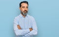 Middle aged man with beard wearing business shirt looking sleepy and tired, exhausted for fatigue and hangover, lazy eyes in the Royalty Free Stock Photo