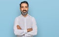 Middle aged man with beard wearing casual white shirt happy face smiling with crossed arms looking at the camera Royalty Free Stock Photo