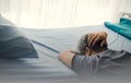 Middle-aged man Crashing down on the patient`s bed, Royalty Free Stock Photo