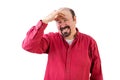 Middle aged man in distress with hand on forehead Royalty Free Stock Photo