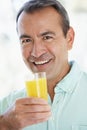 Middle Aged Man Drinking Fresh Orange Juice Royalty Free Stock Photo